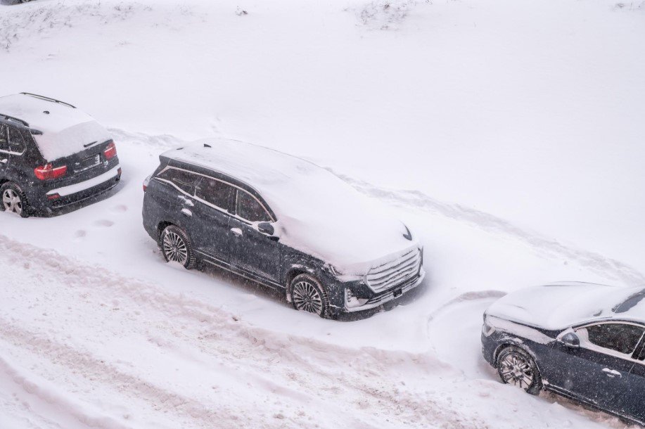 Utility crews repair electricity lines as heavy snow and strong winds cause outages during winter storm in America.