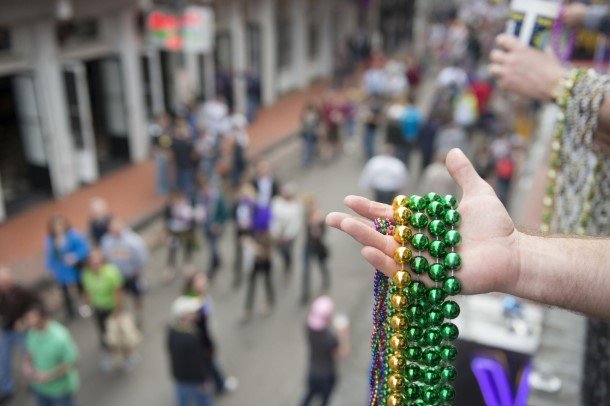 mardi gras beads on a balcony and carnival ornaments on a balcony in a street of the french quarter, new orleans, louisiana 24 mardi gras beads on a balcony and carnival ornaments on a balcony in a street of the french quarter, new orleans, louisiana 24