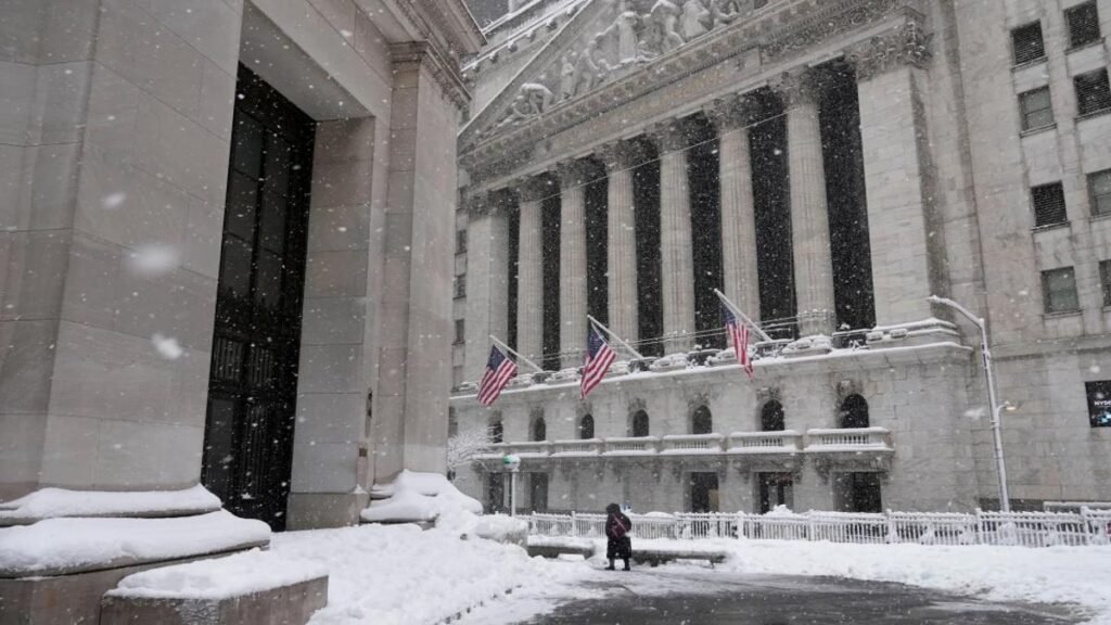 New York Stock Exchange building in snow as stock market reacts to market volatility